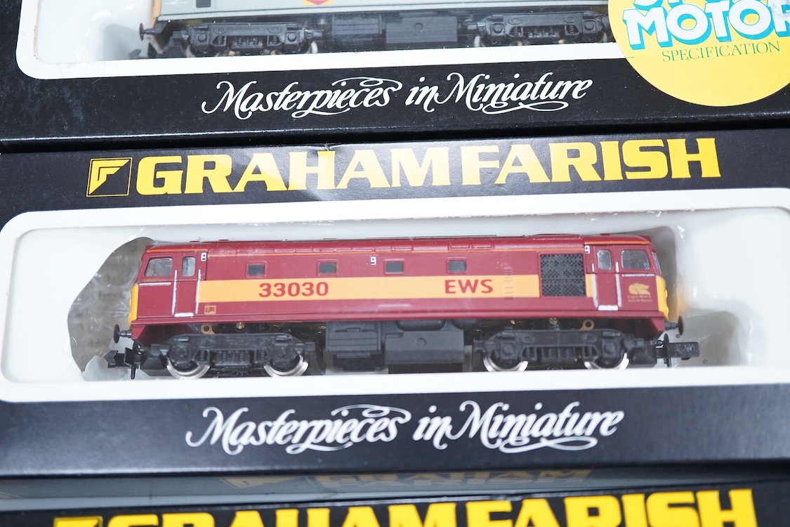 Four boxed Graham Farish N gauge railway Class 33 diesel locomotives; a BR, D6572 (8314), a BR Distribution Sector, 33 205 (8317), an EWS, 33030 (831A) and a BR, 33025 (8312).